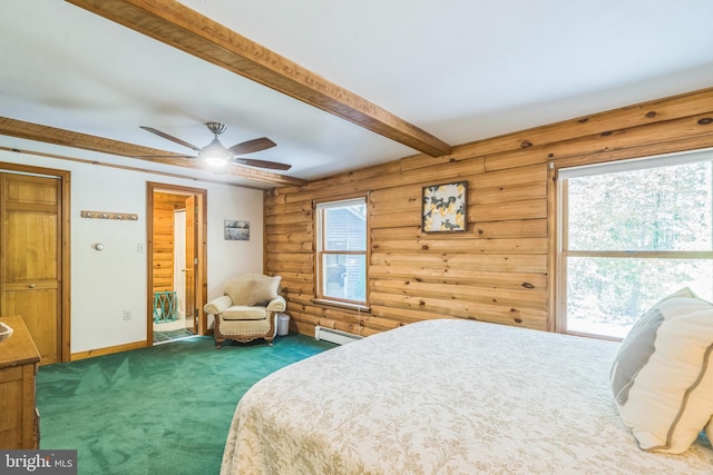 bedroom featuring ceiling fan, beamed ceiling, rustic walls, a baseboard heating unit, and dark colored carpet