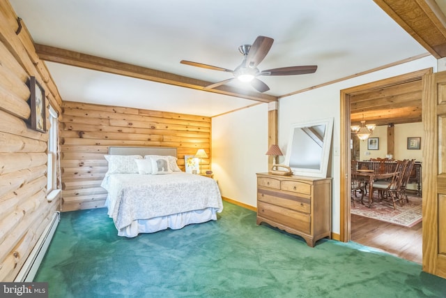 carpeted bedroom with beamed ceiling, wood walls, ornamental molding, a baseboard radiator, and ceiling fan with notable chandelier