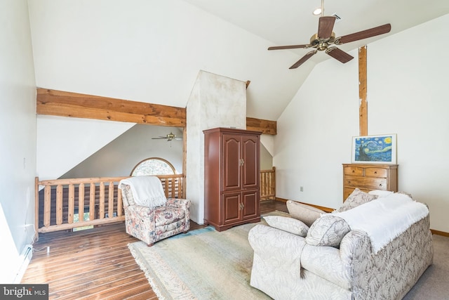 living area with lofted ceiling, ceiling fan, and light hardwood / wood-style floors