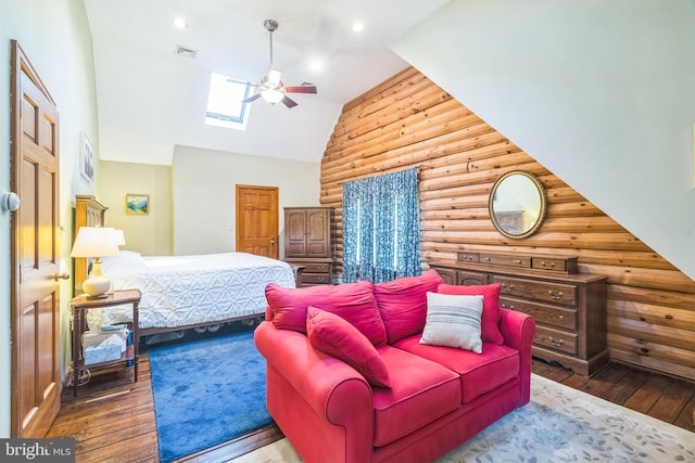 bedroom with a skylight, high vaulted ceiling, hardwood / wood-style flooring, and ceiling fan