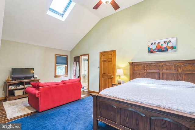 bedroom featuring ceiling fan, dark colored carpet, vaulted ceiling, and multiple windows