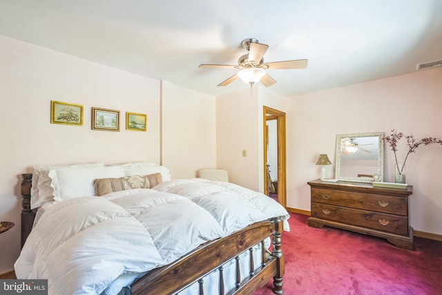 bedroom with dark colored carpet and ceiling fan