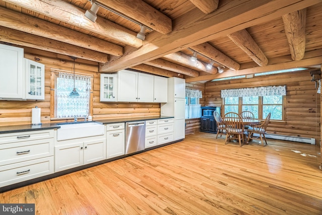 kitchen with sink, stainless steel dishwasher, beam ceiling, and white cabinetry