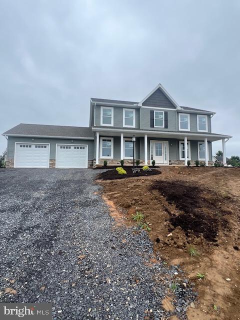 view of front of home with a garage and a porch