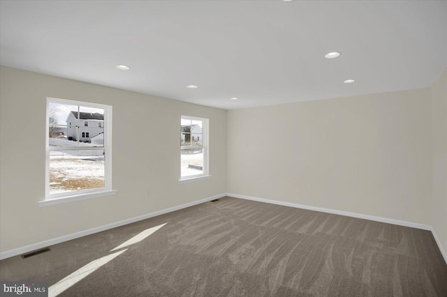 spare room with carpet floors