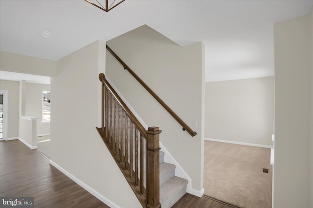 staircase featuring hardwood / wood-style flooring