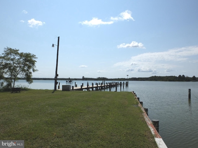 dock area featuring a yard, central AC unit, and a water view