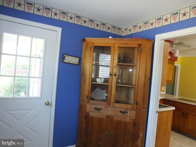 doorway featuring ceiling fan