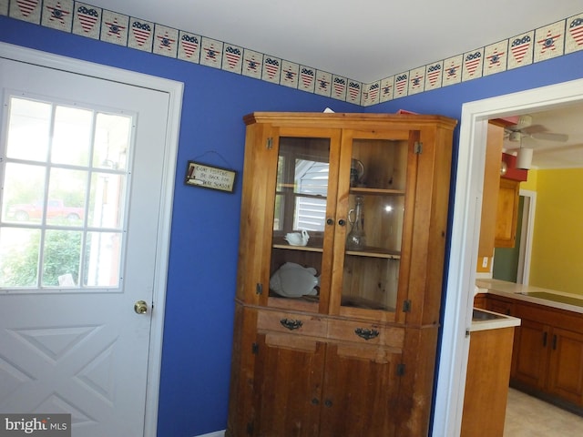 doorway with ceiling fan