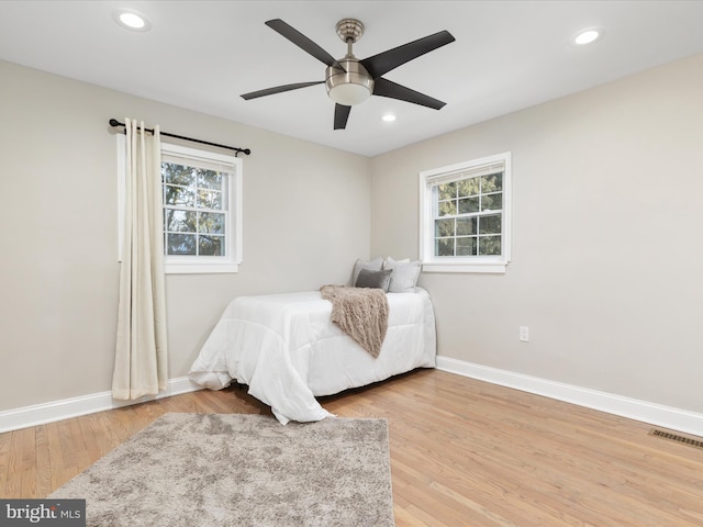 bedroom featuring ceiling fan and wood-type flooring