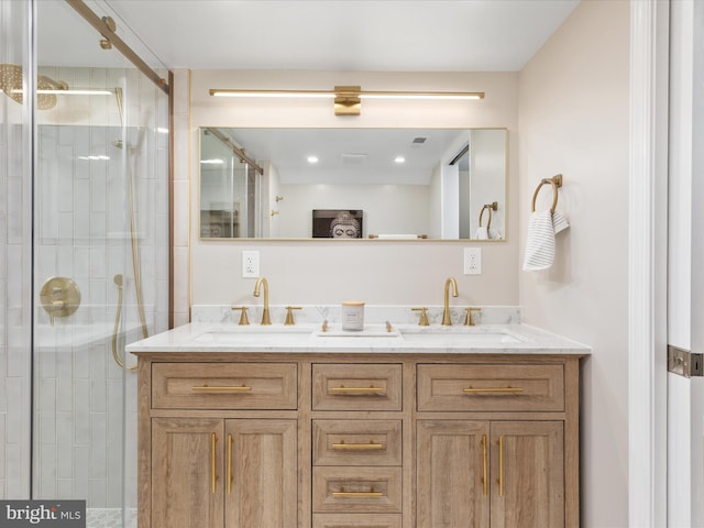 bathroom with an enclosed shower and vanity