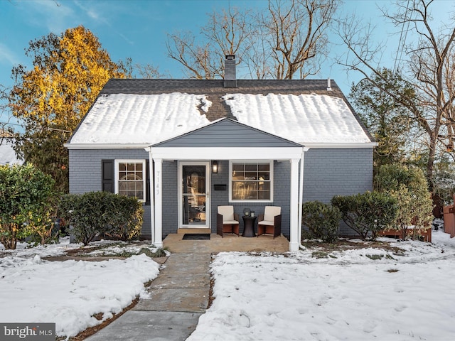 bungalow-style home featuring covered porch