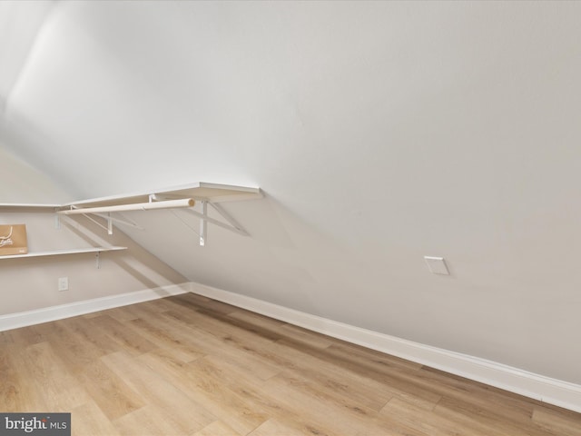 walk in closet featuring light hardwood / wood-style flooring