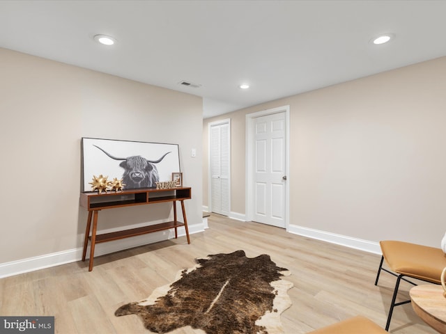 sitting room with light wood-type flooring