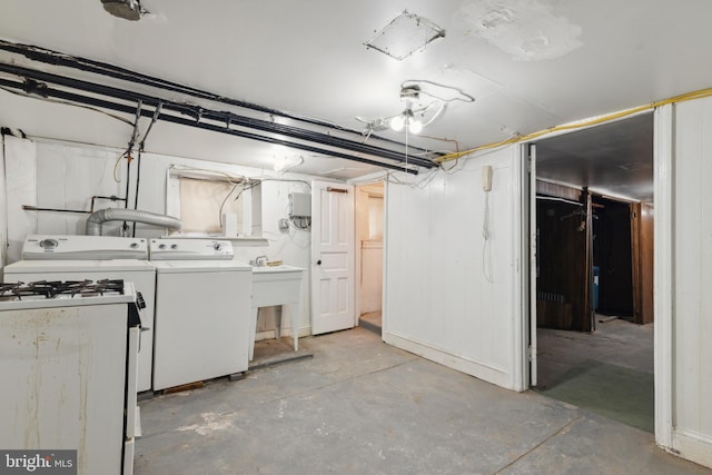 basement with separate washer and dryer and sink