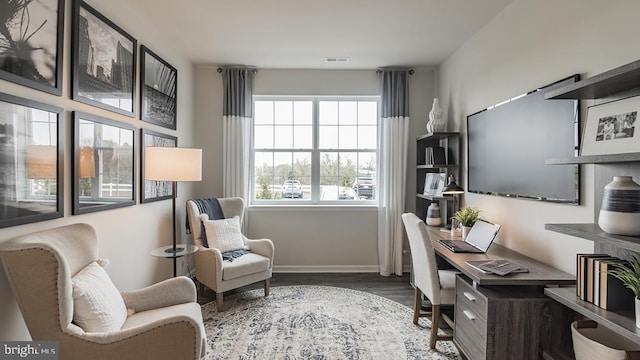 home office with hardwood / wood-style floors