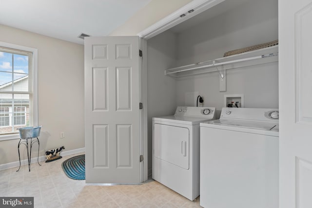 washroom featuring washer and clothes dryer