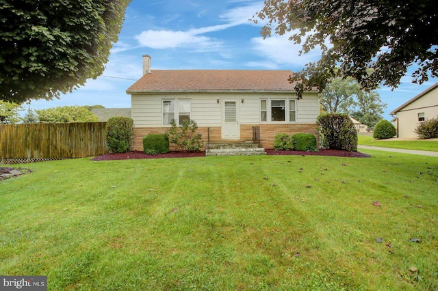 view of front of home with a front lawn