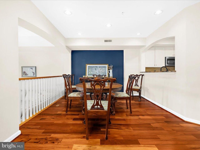 dining room with hardwood / wood-style flooring