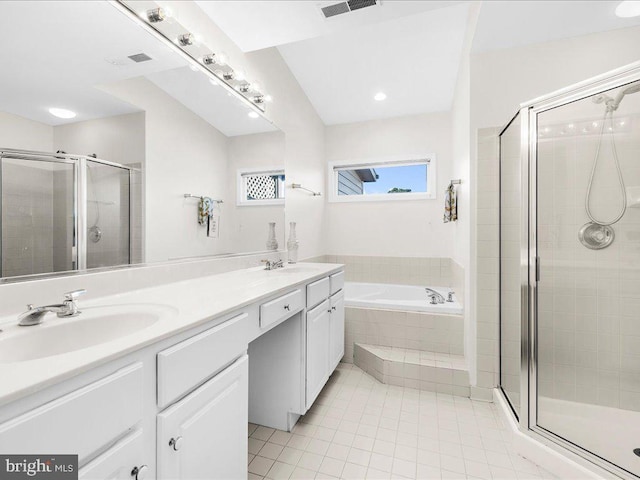 bathroom featuring independent shower and bath, tile patterned flooring, and vanity