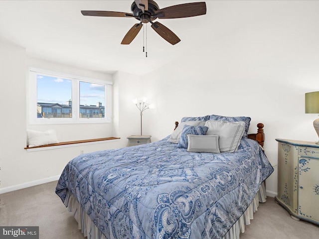 bedroom featuring ceiling fan and light colored carpet