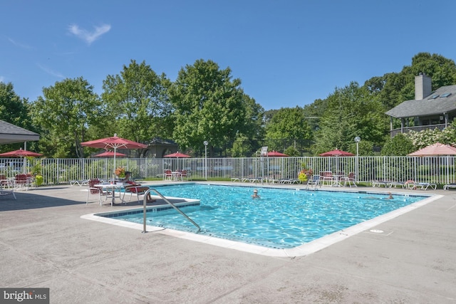 view of swimming pool featuring a patio area