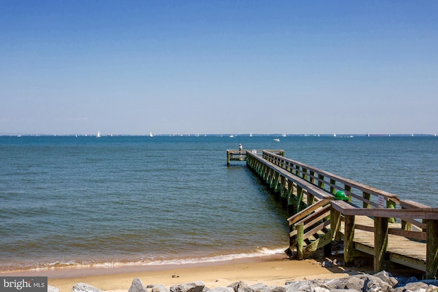 dock area with a water view