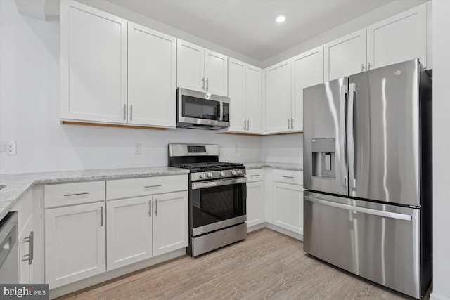 16322 River View Ct, Bristol, PA 19007 - kitchen featuring stainless steel appliances, light wood-style flooring, white cabinets, light stone counters, and recessed lighting