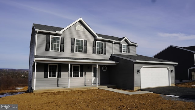 front facade with a garage and covered porch