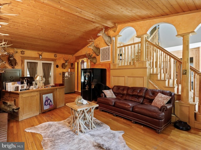 living room featuring wooden ceiling, lofted ceiling, decorative columns, and light hardwood / wood-style floors