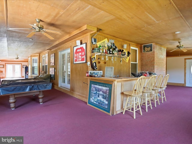 interior space featuring wood ceiling, pool table, indoor bar, ceiling fan, and french doors