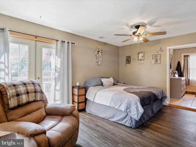 bedroom featuring ceiling fan, access to outside, and dark hardwood / wood-style flooring