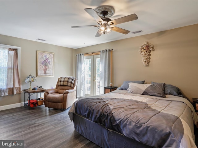 bedroom featuring french doors, dark wood-type flooring, multiple windows, and ceiling fan