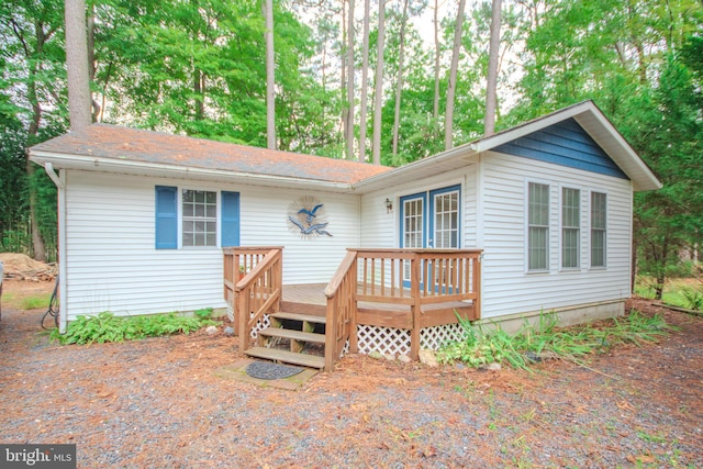 view of front of house featuring a wooden deck