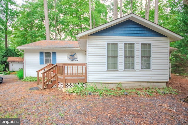 view of front of house with a wooden deck