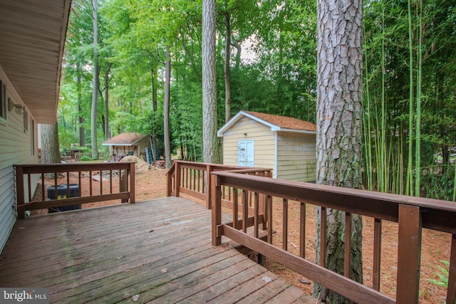 wooden terrace with a storage shed