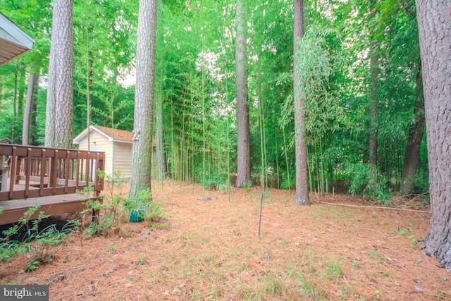 view of yard with a wooden deck