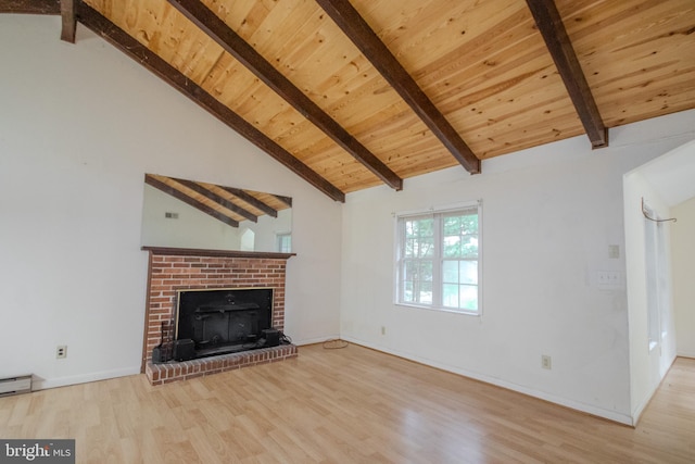 unfurnished living room featuring high vaulted ceiling, light hardwood / wood-style floors, beamed ceiling, and a brick fireplace