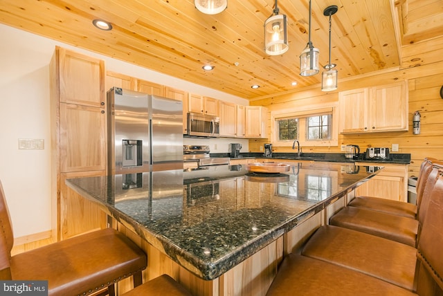 kitchen with a breakfast bar area, a kitchen island, stainless steel appliances, decorative light fixtures, and wooden ceiling