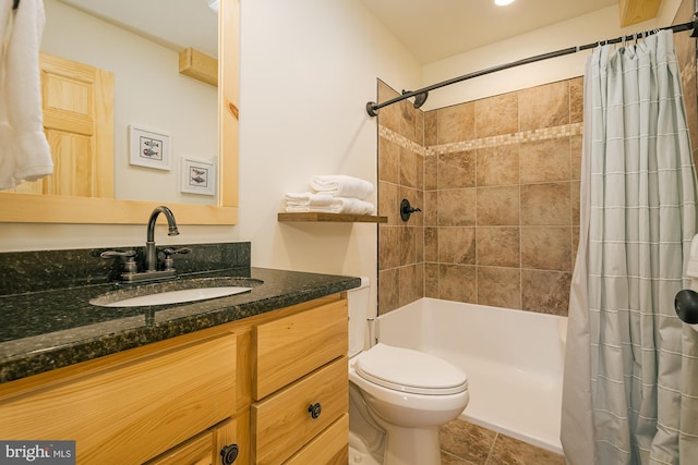 full bathroom with vanity, shower / tub combo, toilet, and tile patterned flooring