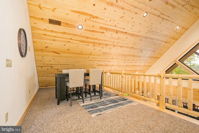 dining area featuring carpet floors, lofted ceiling, and wood ceiling