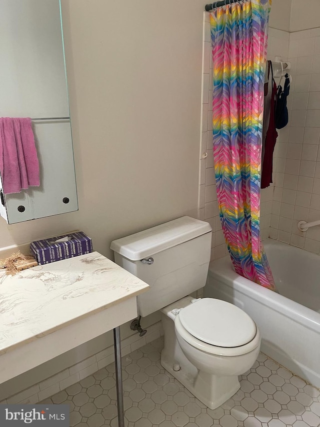 bathroom with toilet and shower / bathtub combination with curtain