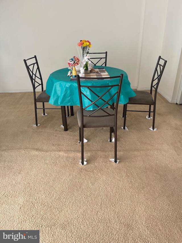 dining area with carpet