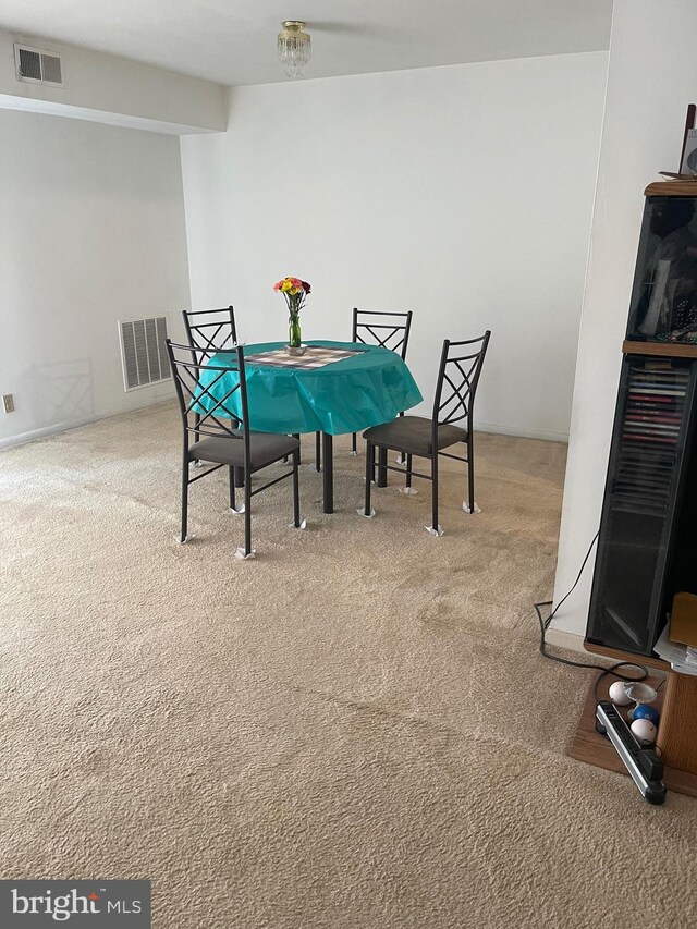 dining room featuring carpet