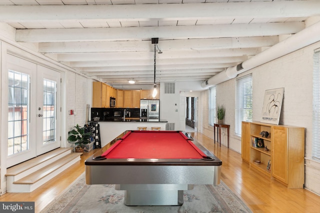 playroom featuring pool table, beamed ceiling, french doors, and light wood-type flooring