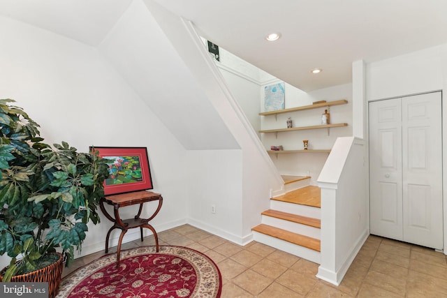 stairs featuring tile patterned floors