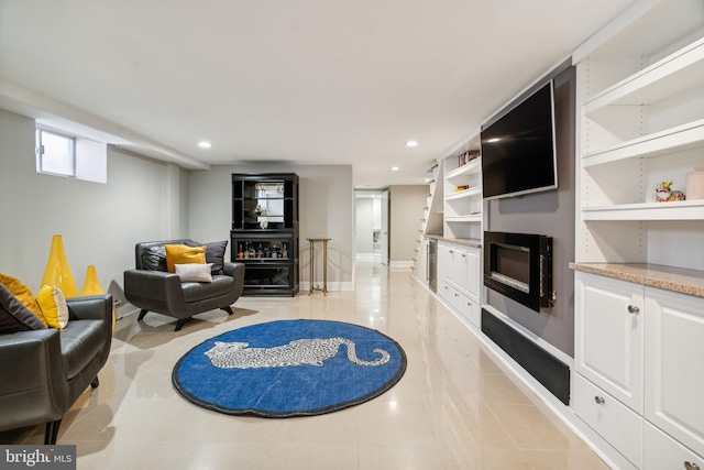 living area featuring baseboards, recessed lighting, light tile patterned flooring, and a fireplace