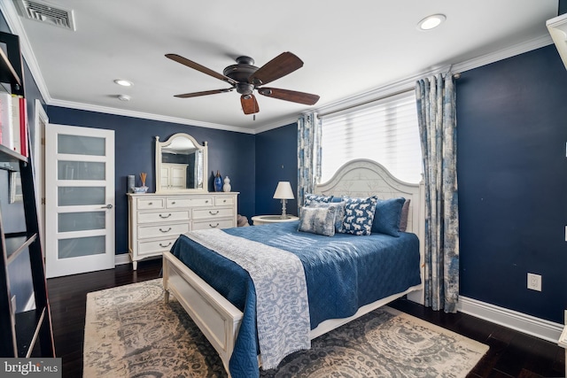 bedroom with dark hardwood / wood-style flooring, ornamental molding, and ceiling fan