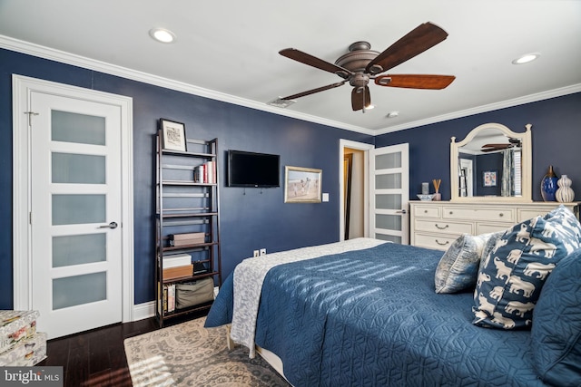 bedroom featuring ceiling fan, ornamental molding, and dark hardwood / wood-style floors