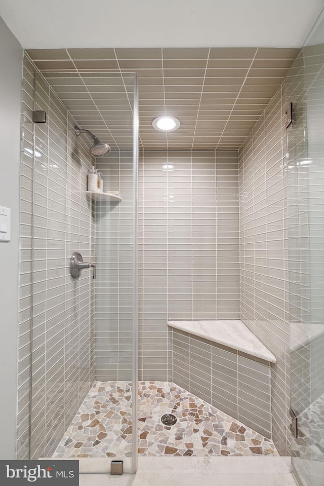 bathroom featuring an enclosed shower